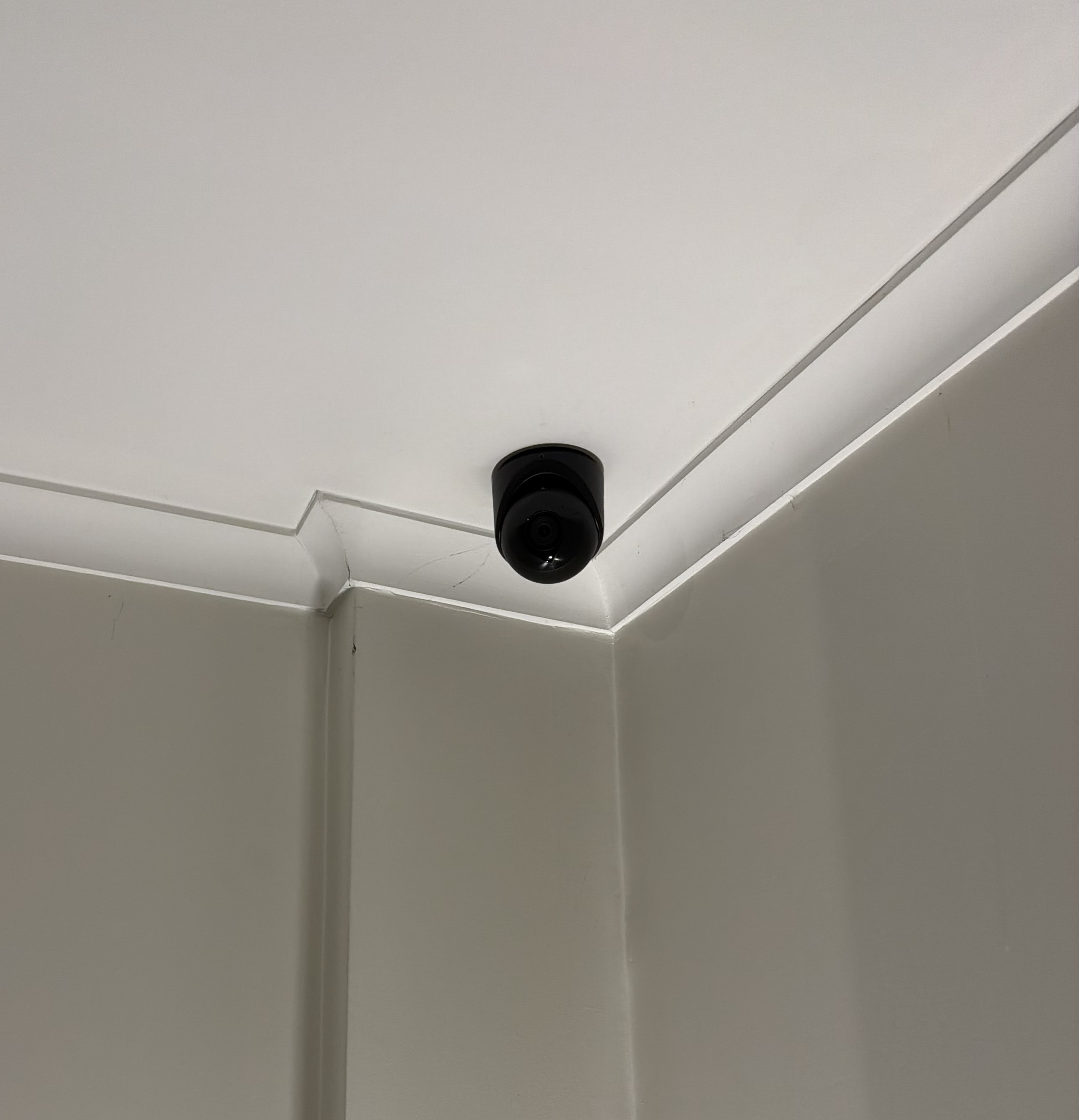 Ceiling corner camera mount